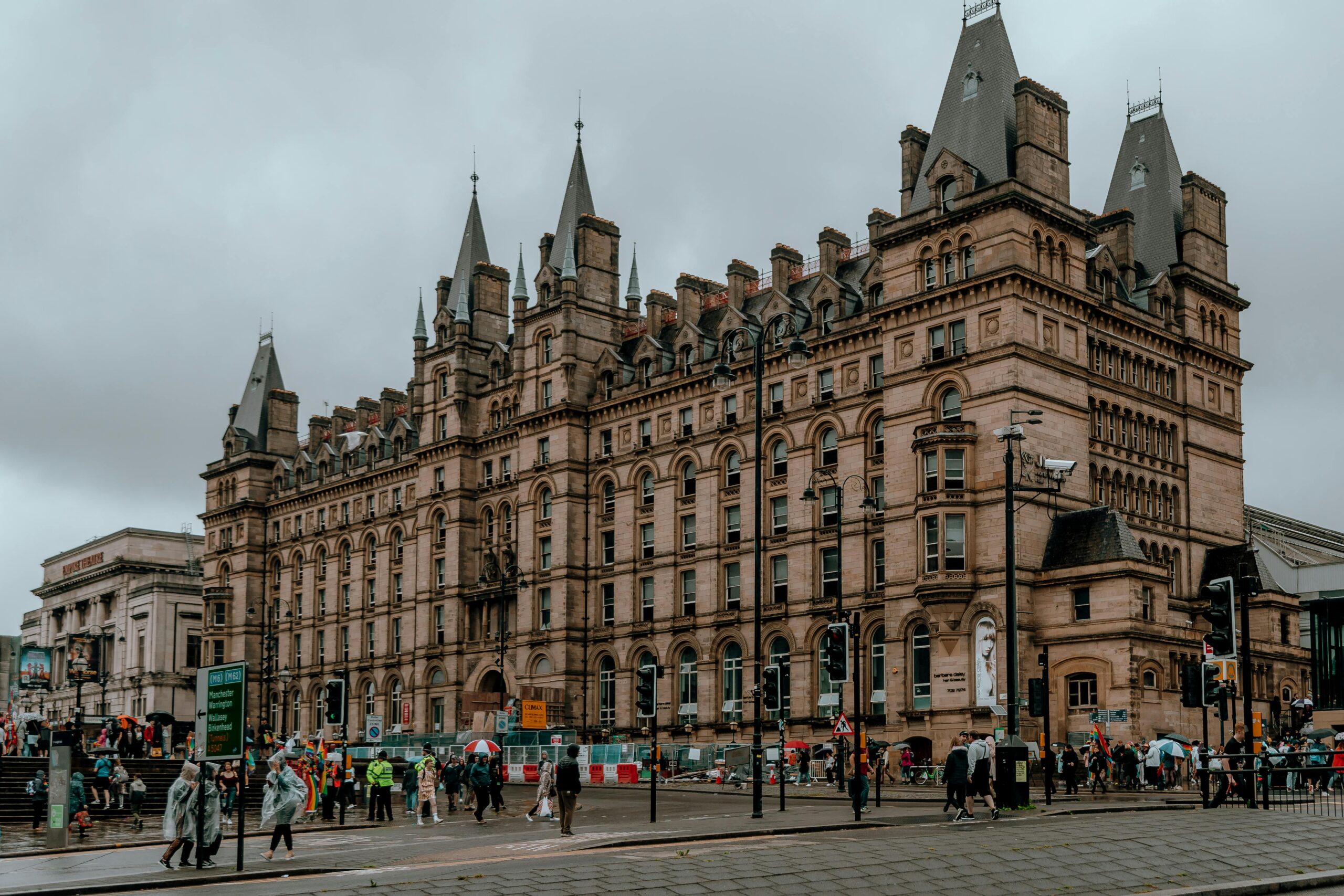 Stunning Victorian architecture in Liverpool city center, bustling with pedestrians.